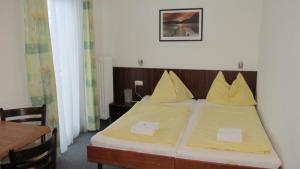 Postel nebo postele na pokoji v ubytování Park Hotel Gastein alle Getränke ganztags inklusive