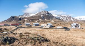 a group of houses in front of a mountain at Sodulsholt Cottages in Sodulsholt