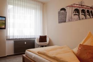 Postel nebo postele na pokoji v ubytování Hotel Credé
