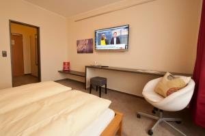 Postel nebo postele na pokoji v ubytování Hotel Credé