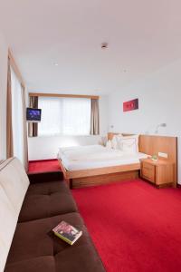 Postel nebo postele na pokoji v ubytování Hotel Garni Auriga