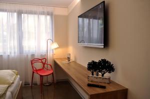 TV a/nebo společenská místnost v ubytování Hotel Credé