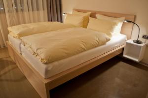 Postel nebo postele na pokoji v ubytování Hotel Credé