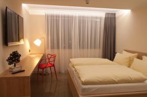 Postel nebo postele na pokoji v ubytování Hotel Credé