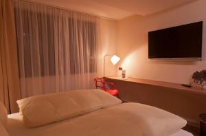 Postel nebo postele na pokoji v ubytování Hotel Credé