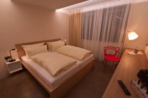 Postel nebo postele na pokoji v ubytování Hotel Credé