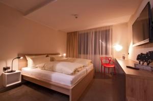 Postel nebo postele na pokoji v ubytování Hotel Credé