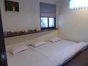 Postel nebo postele na pokoji v ubytování La View 麗晨 Homestay