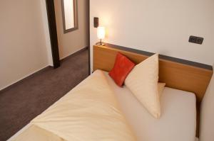 Postel nebo postele na pokoji v ubytování Hotel Credé