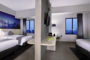 Postel nebo postele na pokoji v ubytování Hotel Neo+ Kebayoran Jakarta