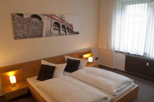Postel nebo postele na pokoji v ubytování Hotel Credé