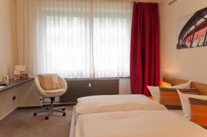 Postel nebo postele na pokoji v ubytování Hotel Credé