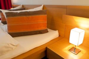 Postel nebo postele na pokoji v ubytování Hotel Credé