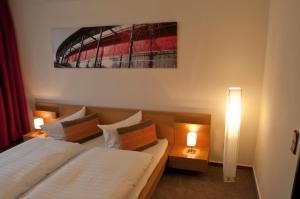 Postel nebo postele na pokoji v ubytování Hotel Credé