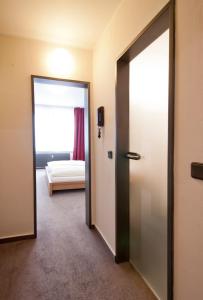Postel nebo postele na pokoji v ubytování Hotel Credé