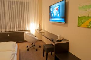 TV a/nebo společenská místnost v ubytování Hotel Credé