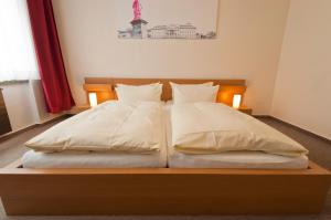 Postel nebo postele na pokoji v ubytování Hotel Credé