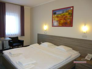 Łóżko lub łóżka w pokoju w obiekcie Paprika M1 Hotel