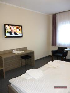 Łóżko lub łóżka w pokoju w obiekcie Paprika M1 Hotel