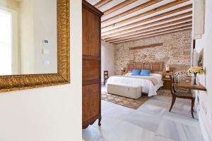 Posteľ alebo postele v izbe v ubytovaní Hotel Casa de las Cuatro Torres
