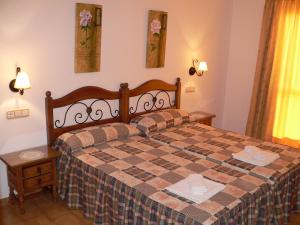 Ένα ή περισσότερα κρεβάτια σε δωμάτιο στο Apartamentos Casanova