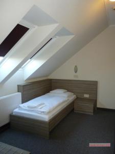 Łóżko lub łóżka w pokoju w obiekcie Paprika M1 Hotel