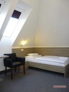 Łóżko lub łóżka w pokoju w obiekcie Paprika M1 Hotel