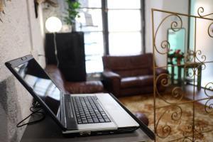 a laptop computer sitting on a table in a living room at Pigal in Tarragona