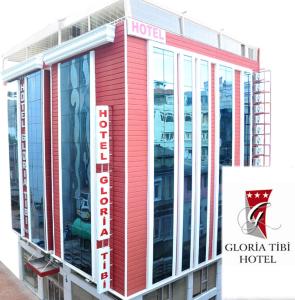 un edificio rojo con un hotel de confianza gurgaon en Gloria Tibi Hotel en Samsun