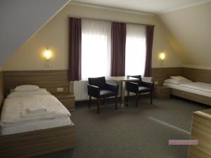 Łóżko lub łóżka w pokoju w obiekcie Paprika M1 Hotel