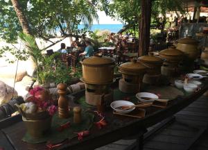 a table topped with lots of pots and pans at Koh Tao Cabana in Ko Tao