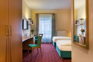 Postel nebo postele na pokoji v ubytování Mercure Hotel Ingolstadt