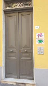 a door that has a blue door on it at Palafiori Rooms Sanremo in Sanremo