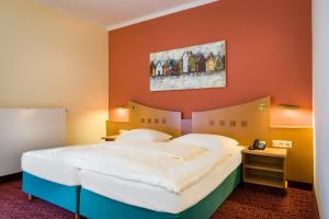 Postel nebo postele na pokoji v ubytování Mercure Hotel Ingolstadt + 37 fotografií