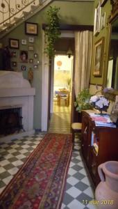 a hallway with a living room with a fireplace at Agriturismo Allo Scoglio - Azienda Agricola in Trieste