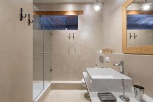 a bathroom with a shower and a sink at BCN Rambla Catalunya Apartments in Barcelona +157 photos