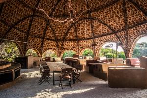 a large room with a table and chairs in it at Wild Coast Tented Lodge - Relais and Chateaux in Yala