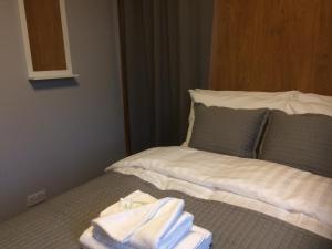 Katil atau katil-katil dalam bilik di TW4 Apartments – Hounslow