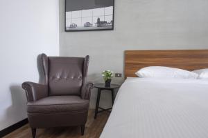 Voodi või voodid majutusasutuse OX Suites toas