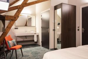 Postel nebo postele na pokoji v ubytování Hotel de Koppelpaarden