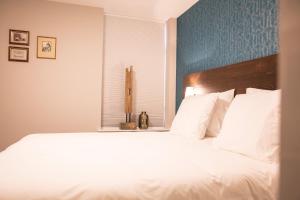 Postel nebo postele na pokoji v ubytování Hotel de Koppelpaarden