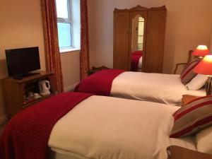 Postel nebo postele na pokoji v ubytování O Donovans Hotel