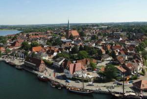 an aerial view of a small town by the water at Ferienwohnung Maren Graf in Neustadt in Holstein