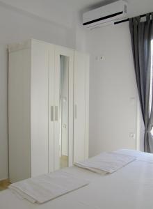 Postel nebo postele na pokoji v ubytování Helios Studios & Apartments