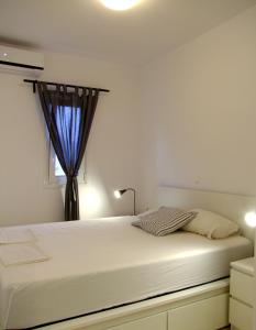 Postel nebo postele na pokoji v ubytování Helios Studios & Apartments