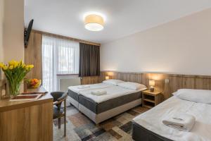 Postel nebo postele na pokoji v ubytování Ośrodek Wypoczynkowy Borowy + 34 fotografií