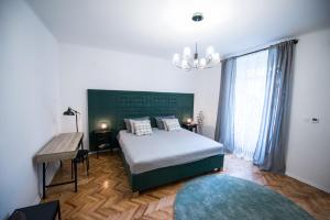 Säng eller sängar i ett rum på City Apartments Green Oasis