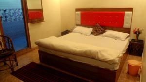 Ένα ή περισσότερα κρεβάτια σε δωμάτιο στο Hotel Rattans Regency
