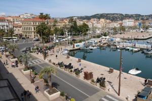 a view of a city with a harbor and boats at Luxury 1 bedroom Quai St Pierre 2 mins from the Palais & Croisette 269 in Cannes