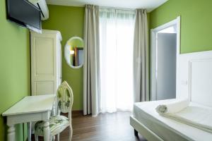 Postel nebo postele na pokoji v ubytování Hotel Speranza
